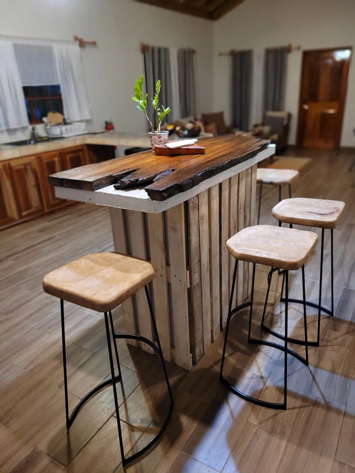 Reclaimed-wood bar with stools