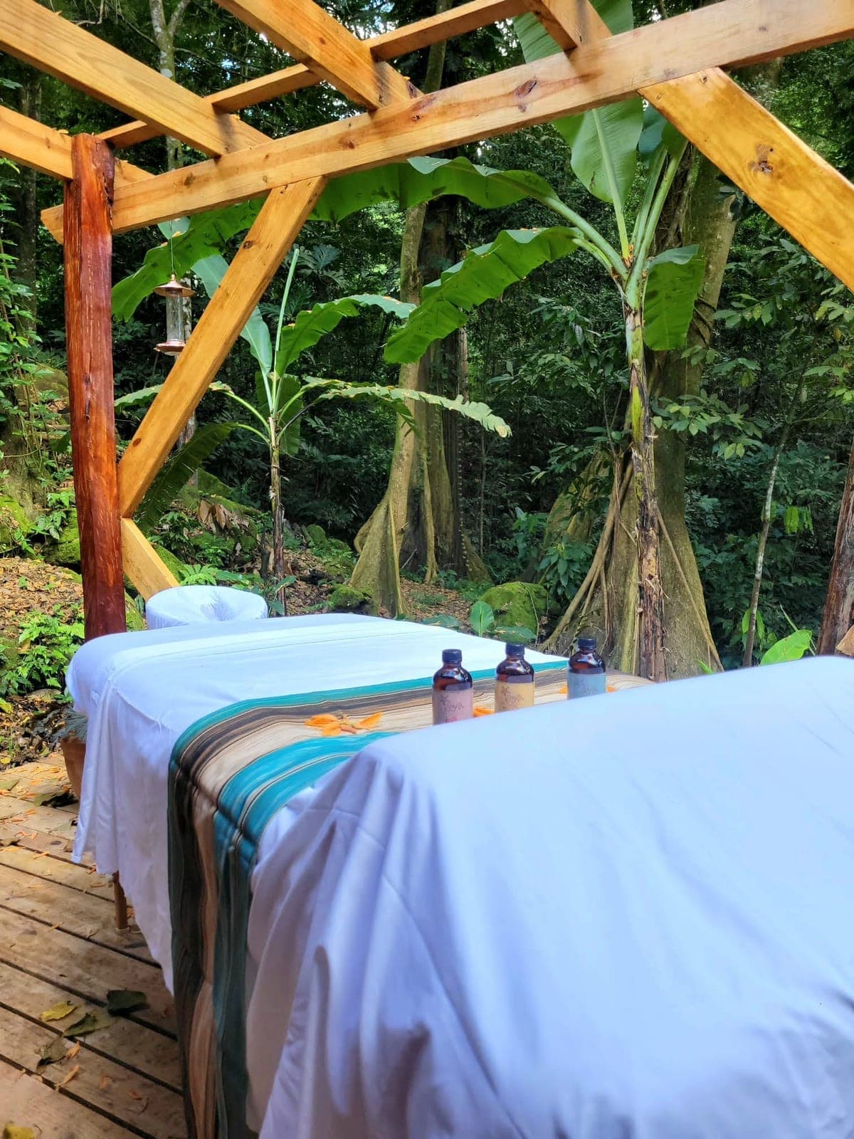 Outdoor massage tables on a jungle deck